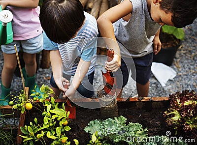 Diversity Group Of Kids Garden Shovel Watering Can Stock Photo