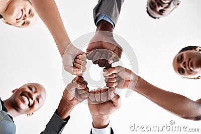 Diversity, hand, or fist group of business people trust, unite and support at work. Below view of happy corporate Stock Photo