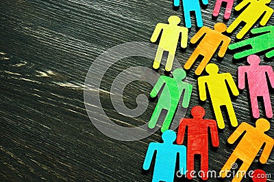 Diversity and inclusion background on the dark wooden desk with free space. Stock Photo