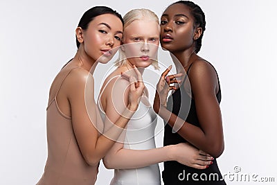 Models wearing camisoles posing for diversity magazine Stock Photo