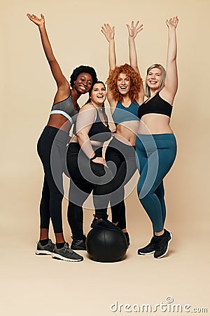 Diversity Models. Different Ethnicity And Size Women. Smiling Multicultural Friends In Sportswear Looking At Camera. Stock Photo