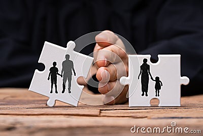 Dividing Two Jigsaw Puzzle Pieces Showing Divorce Concept Stock Photo