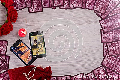 Divination cards alignment with roses and candles. Erotic card deck. Mystery, astrology, fortune telling, belief, love Editorial Stock Photo