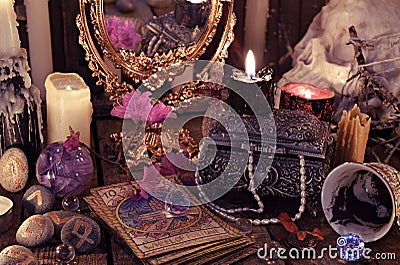 Divination rite with the tarot cards, flowers and mystic objects Stock Photo