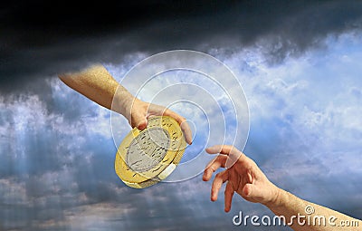 Divine hand heaven god arm gold pound coin money cash charity handout help aid assist donate fund Stock Photo