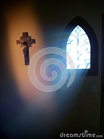 Divine light coming through the window of a church. Stock Photo