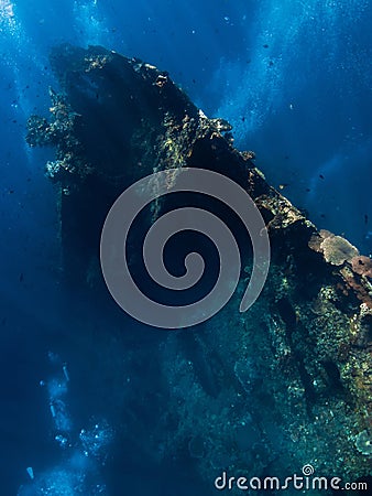 Diving at USAT Liberty Wreck in Tulamben. Freediving in deep sea Stock Photo