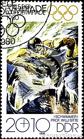 01 16 2020 Divnoe Stavropol Territory Russia postage stamp GDR 1980 Olympic Games - Moscow, USSR swimming swimmer in a water Editorial Stock Photo