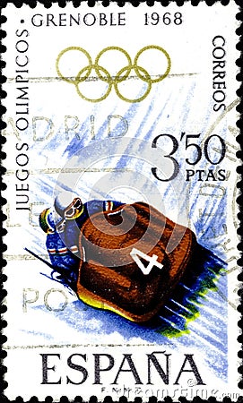 02 10 2020 Divnoe Stavropol Territory Russia postage stamp Spain 1968 Winter Olympic Games - Grenoble, France bobsled bob on a Editorial Stock Photo