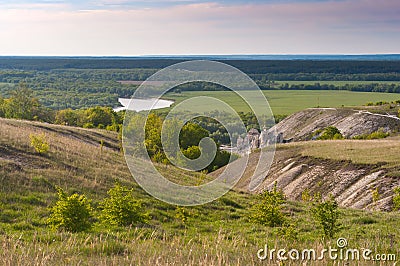Steppe landscape with a river, hills and a cave Church Stock Photo