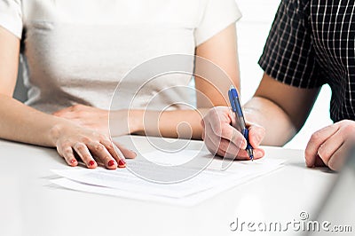 Divorce agreement. Couple signing legal document. Prenuptial marriage settlement, prenup. Lawyer meeting. Separation, breakup. Stock Photo