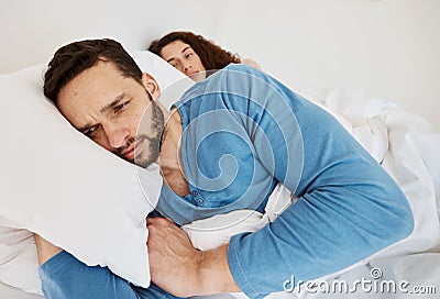 Divorce, fight and angry couple in bed after fight, discussion or frustrated by cheating wife at home. Bedroom, problem Stock Photo