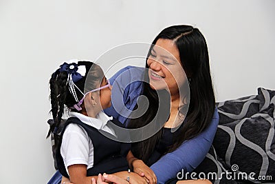 Divorced single mom and 4-year-old brunette Latina daughter enjoy quality time after school on Mother's Day Stock Photo