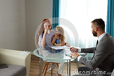 Divorced single redhead mother with child get help by professional psychologist Stock Photo