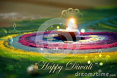 Diwali diya on colorful rangoli Stock Photo