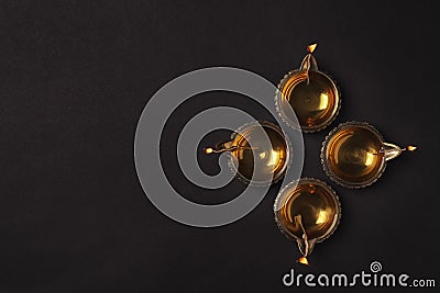 Diwali diyas or clay lamps on dark background Stock Photo