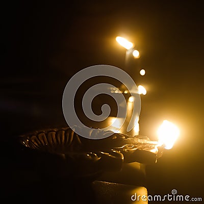 Diwali festival celebrating with glowing Diyas Stock Photo