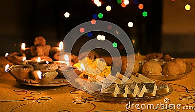 Diwali Lamps with Indian Sweets Stock Photo
