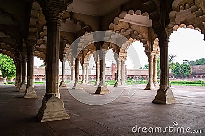 Diwan-I-Am Hall of Audience in Agra Red Fort from inside with ambient light creating soft shadows and overexposed bright sky as Stock Photo
