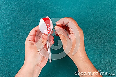 Diy cinco de mayo maracas from eggs, spoons and cereals on a green background Stock Photo