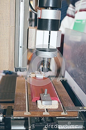 DIY Mini CNC Machine for 3D carving. Process of 3D cutting, machining and sculpting. Stock Photo