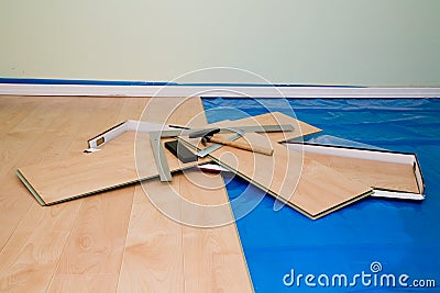 DIY project: installing maple finished laminate floor in living Stock Photo