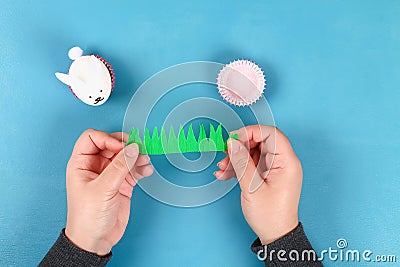 Diy rabbit from easter eggs on blue background. Gift ideas, decor Easter, spring. Handmade Stock Photo