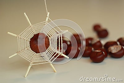 Diy spider figure of yarns, chestnuts and matches. Stock Photo