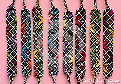 DIY woven friendship bracelets with abstract geometric pattern. Summer accessories Stock Photo