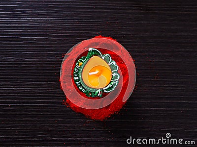 Diya/Lamp placed on rangoli to celebrate Diwali and Dhanteras Stock Photo