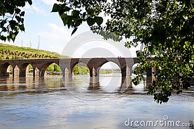 The Dicle Bridge is a historic bridge in DiyarbakÄ±r over the river Tigris in southeastern Turkey. Editorial Stock Photo
