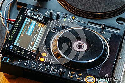 DJ Equipment Deck With Music Track Control And Mixer At Club Party Stock Photo