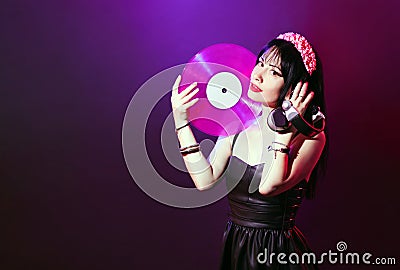 Dj headphone equipment disco girl party retro vintage ultraviolet mixer young woman vinyl glamor valentine`s day plastic pink Stock Photo