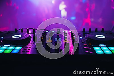 DJ mixer on the table background the night club Stock Photo