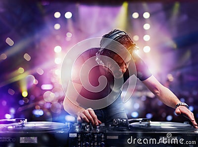 DJ playing music at the discotheque Stock Photo