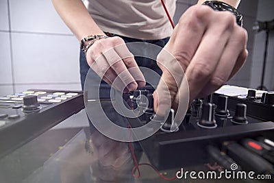 DJ playing music at mixer closeup Stock Photo