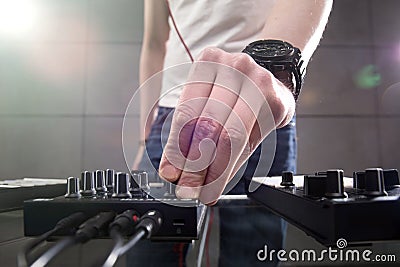 DJ playing music at mixer closeup Stock Photo