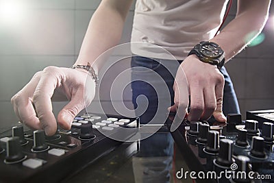 DJ playing music at mixer closeup Stock Photo