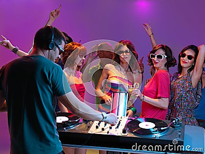 Dj playing music in night club Stock Photo