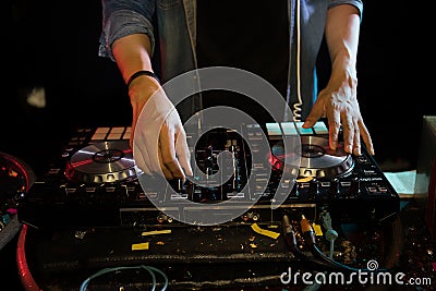 DJ playing turntable music on night club Stock Photo