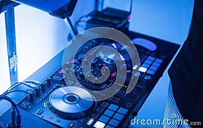 DJ plays and mix music on digital mixer controller. Close-up DJ performance controller, digital midi turntable system Stock Photo