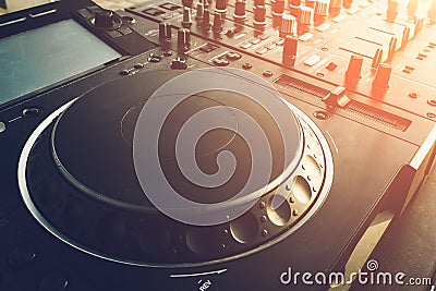 DJ turntable deck mixer close up, sound equipment, audio control panel for party, night clubs or music studio Stock Photo