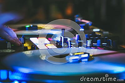 DJ vinyl players in dark nightclub, party in the dance club Editorial Stock Photo