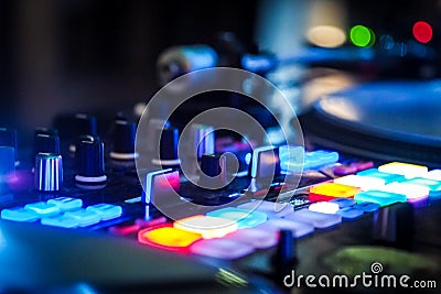 DJ vinyl players in dark nightclub, party in the dance club Editorial Stock Photo