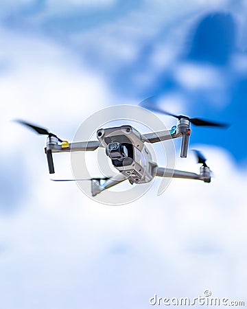 DJI Mavic Air 2 in flight blue sky Stock Photo