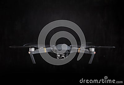 DJI Mavic Pro drone - Flying in the dark, on black background. Closeup on dark. One of the most portable drones in the Editorial Stock Photo