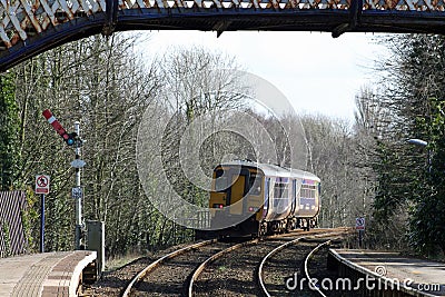 Dmu train Arnside passing red semaphore signal Editorial Stock Photo
