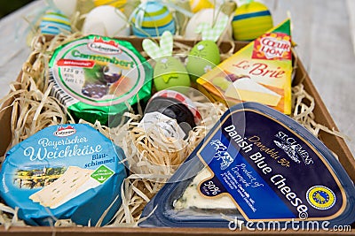 Delicious fresh Easter breakfast with different types of cheese and beautiful bright Easter Editorial Stock Photo