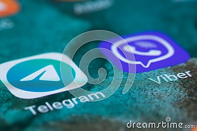 Dnipo, Ukraine, October 17, 2022: Telegram icon app and Viber messenger icon app on the screen smartphone closeup Editorial Stock Photo