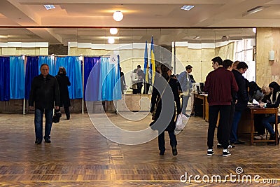 DNIPRO, UKRAINE - 2019 April, 21: Voters near voting booth at polling station during the second round of the election of President Editorial Stock Photo